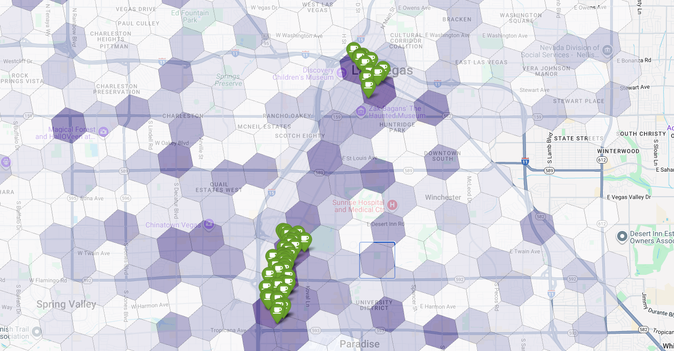 A map of Las Vegas with a purple hexagonal grid showing high-potential areas
and green pins indicating existing coffee
shops.